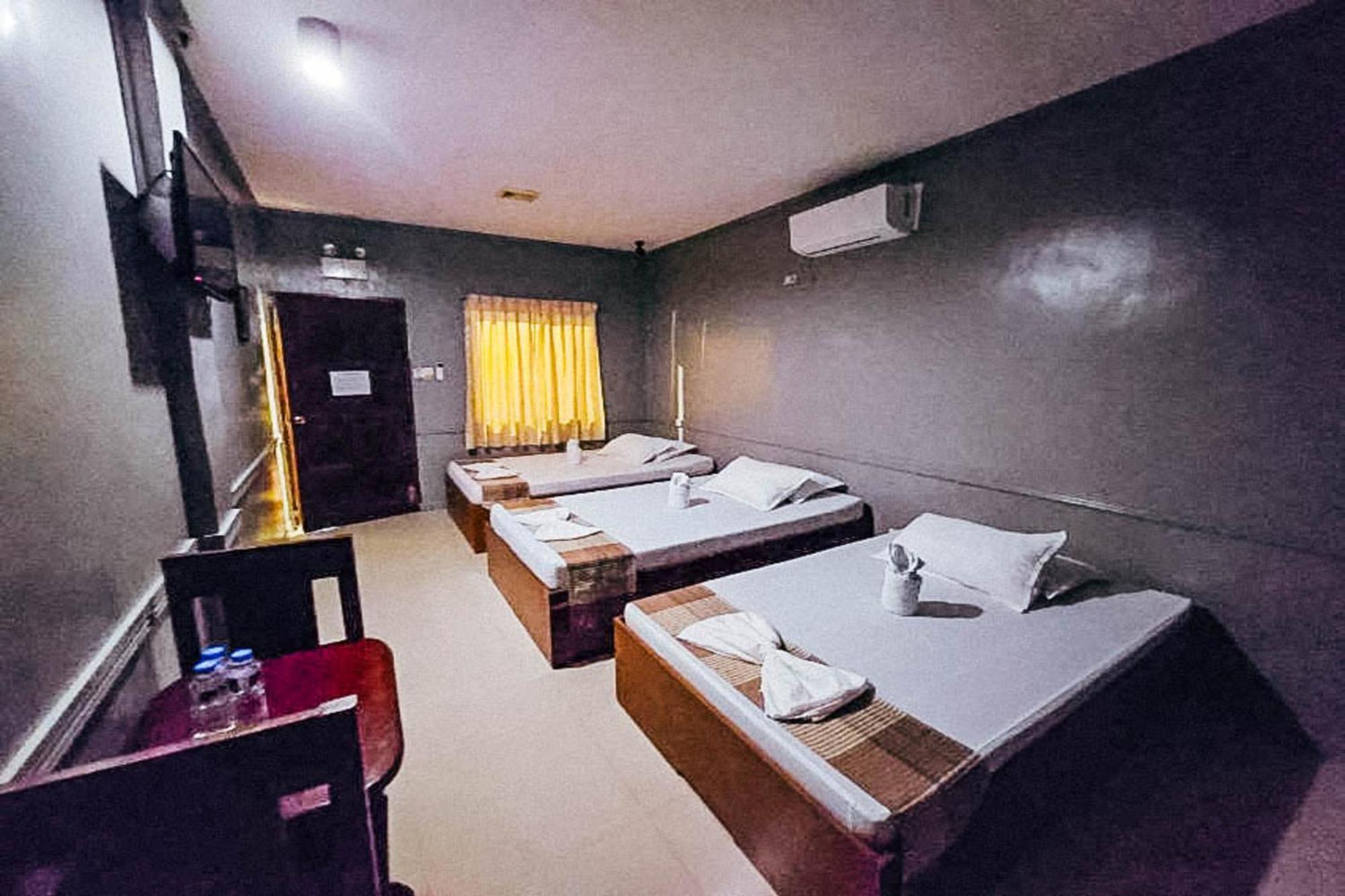 Mbg Travellers Inn Powered By Cocotel Puerto Princesa Rom bilde