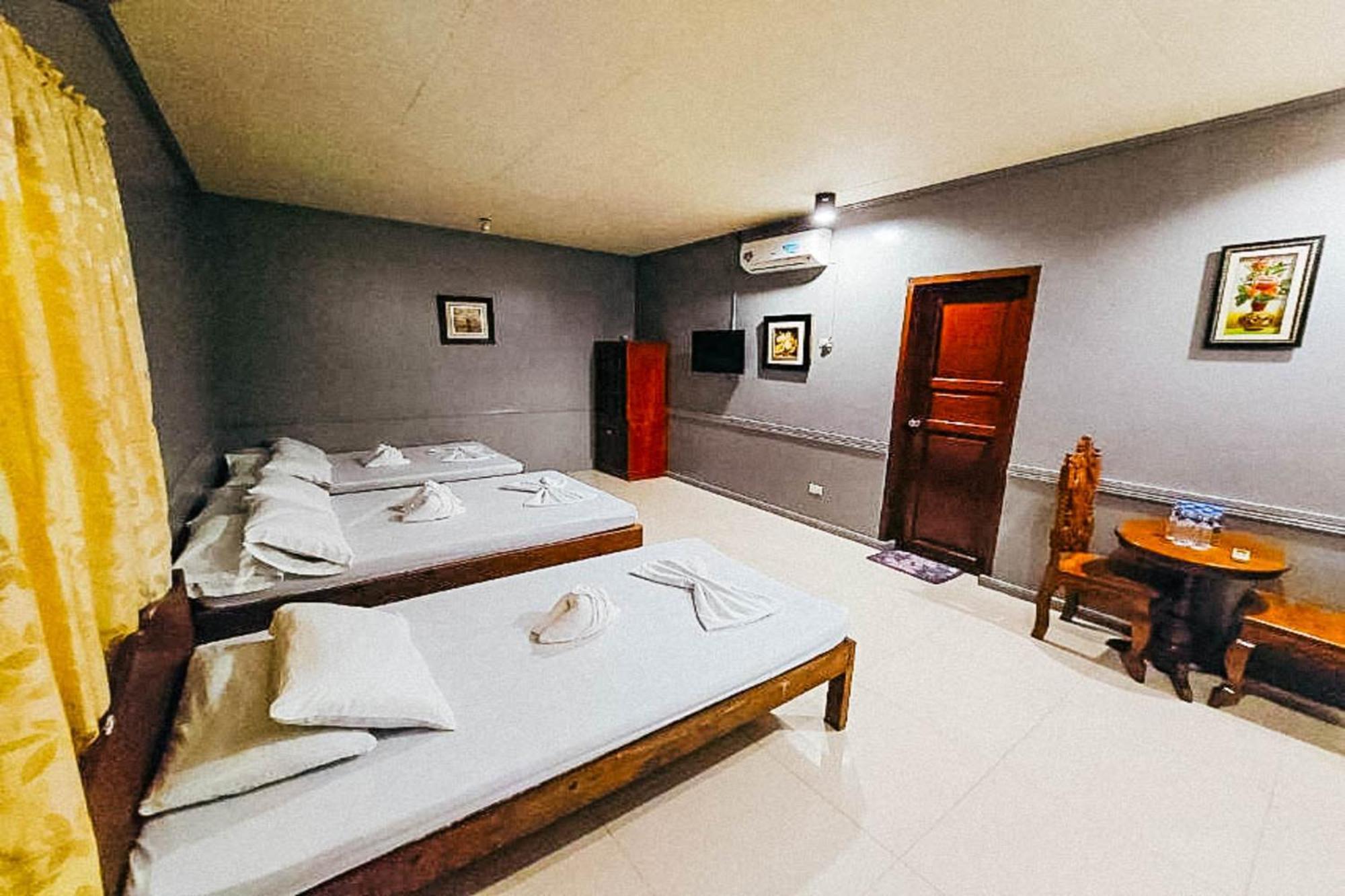 Mbg Travellers Inn Powered By Cocotel Puerto Princesa Rom bilde