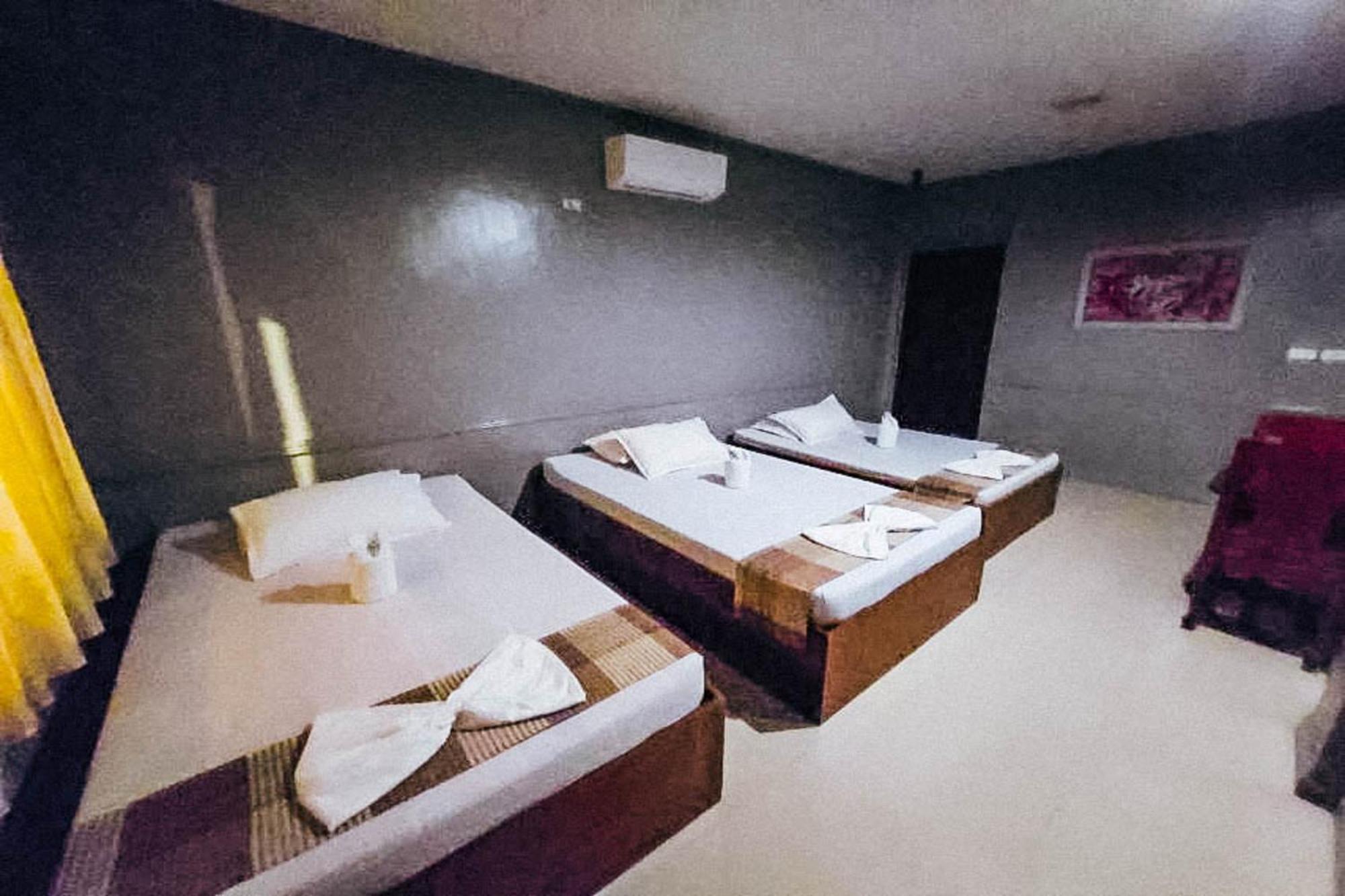Mbg Travellers Inn Powered By Cocotel Puerto Princesa Rom bilde