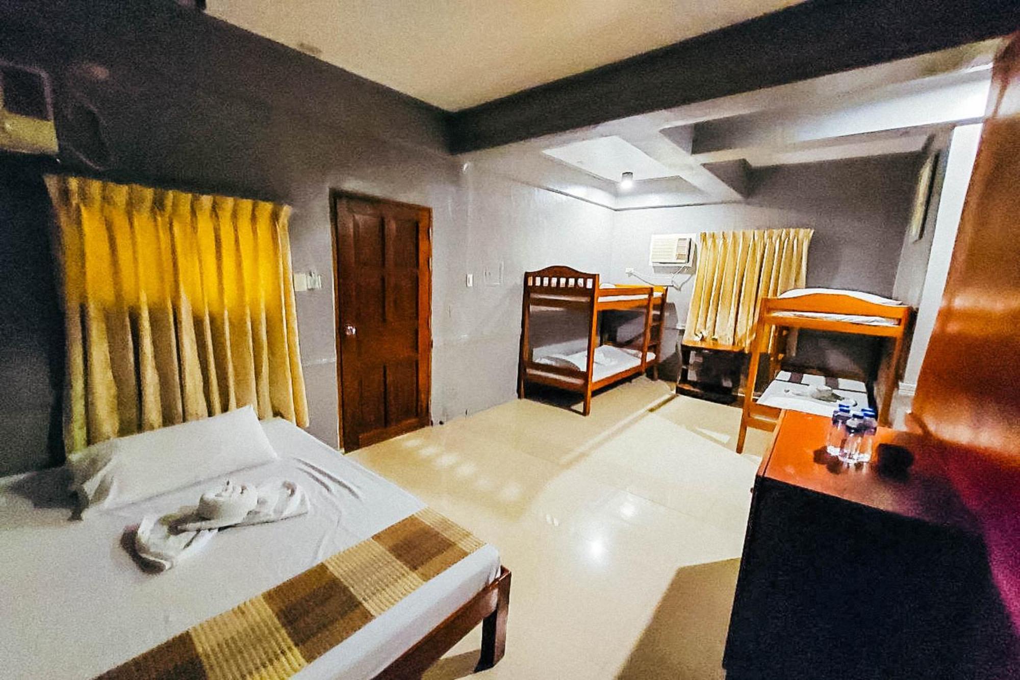Mbg Travellers Inn Powered By Cocotel Puerto Princesa Rom bilde