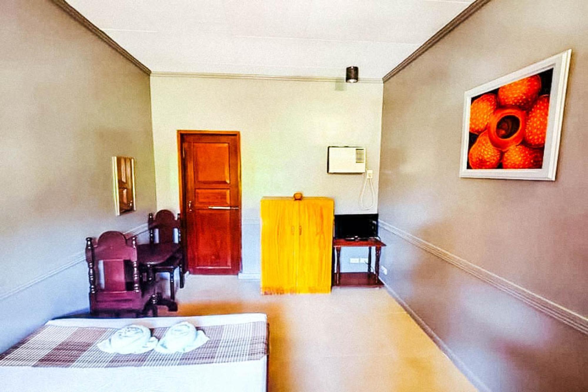 Mbg Travellers Inn Powered By Cocotel Puerto Princesa Rom bilde