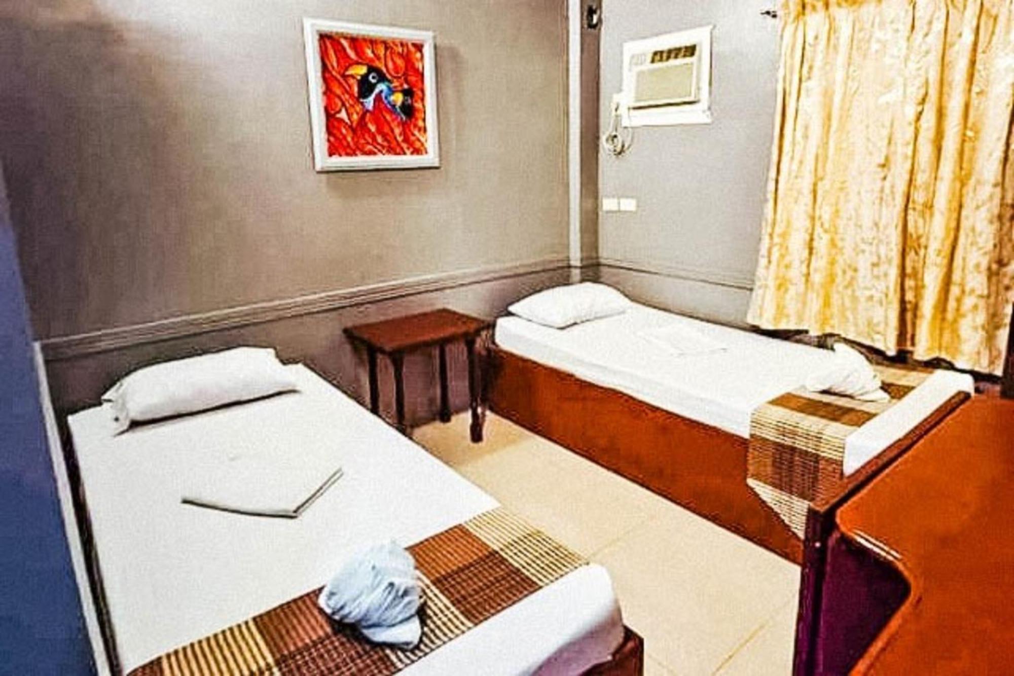 Mbg Travellers Inn Powered By Cocotel Puerto Princesa Rom bilde