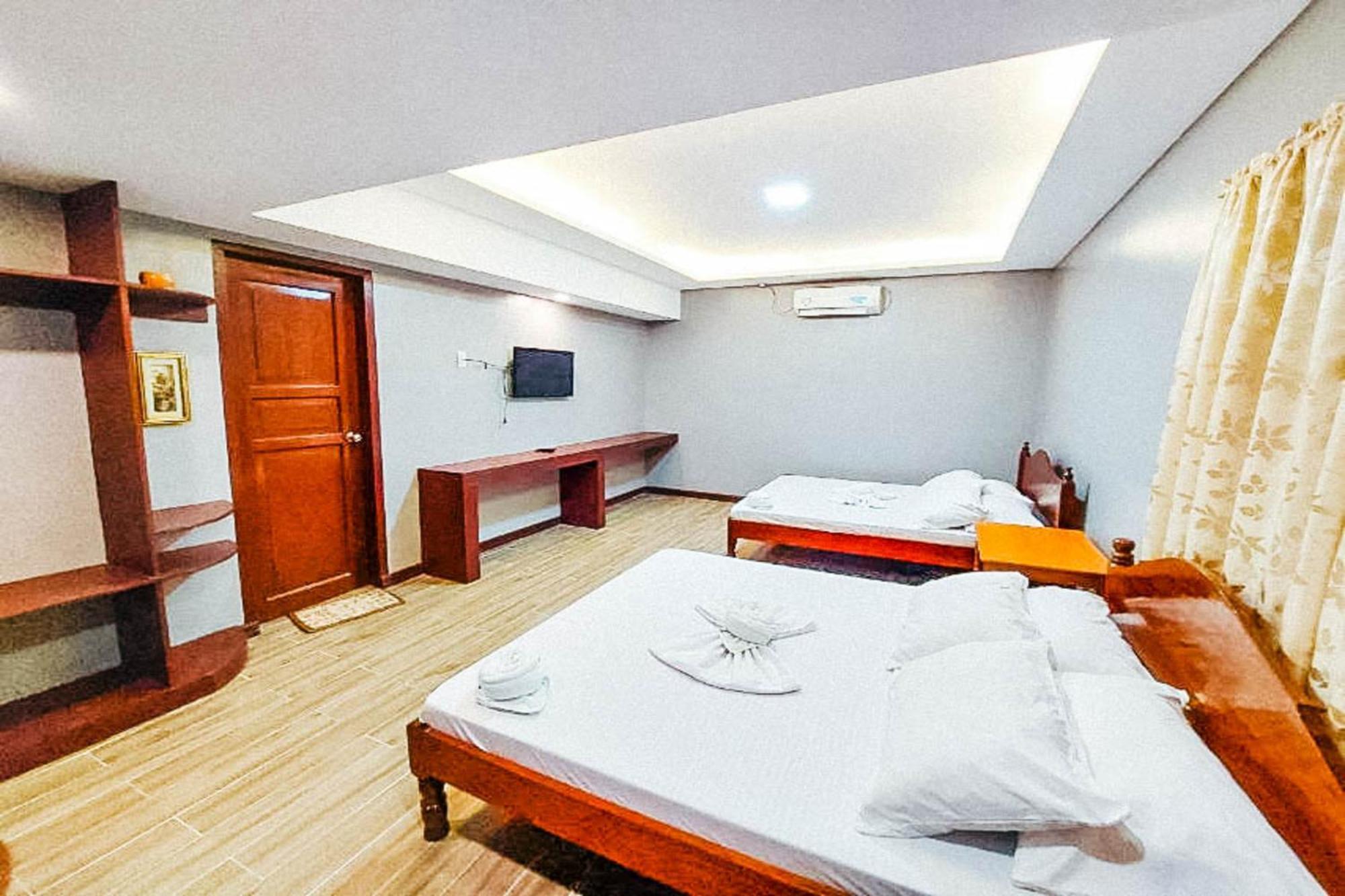 Mbg Travellers Inn Powered By Cocotel Puerto Princesa Rom bilde