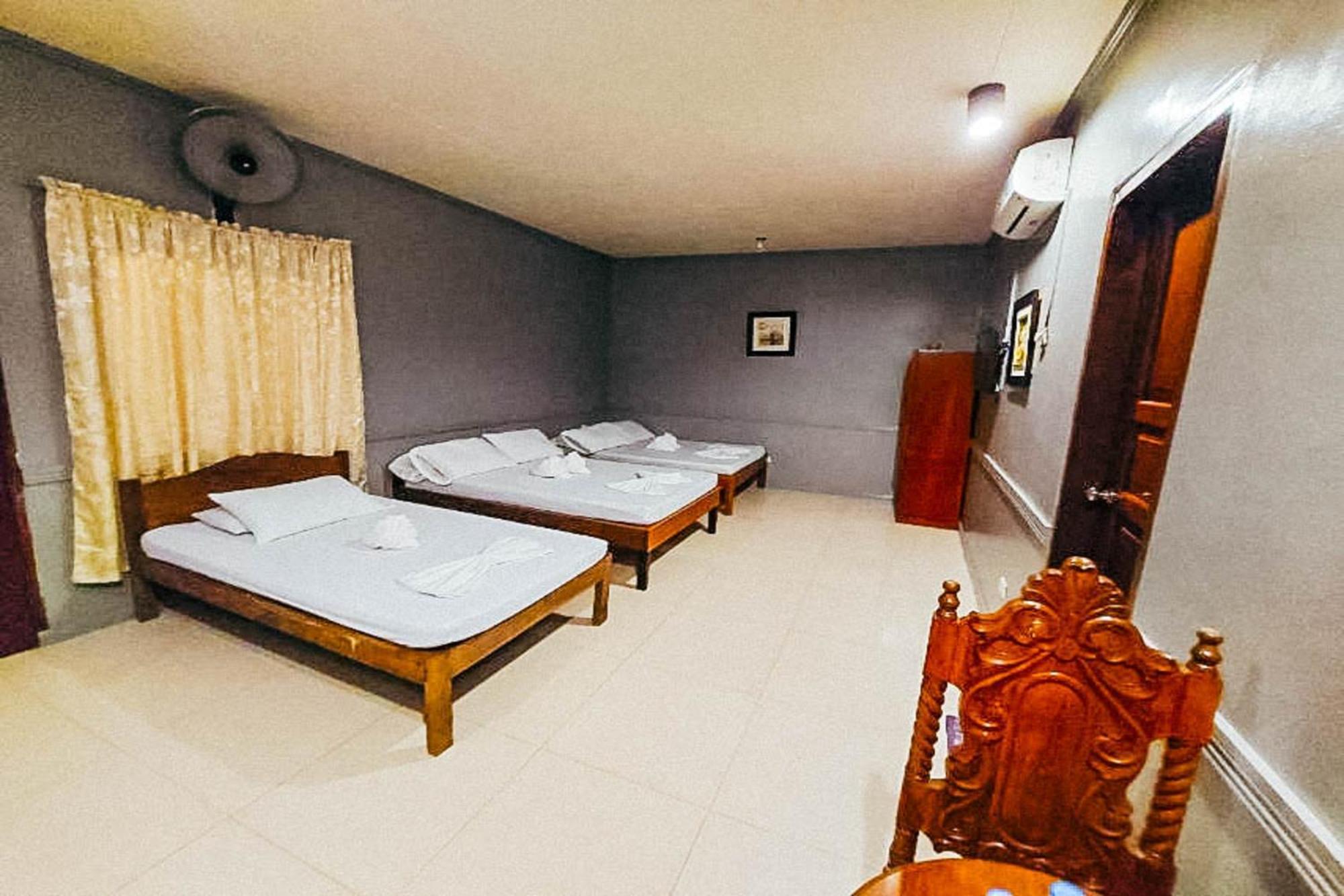 Mbg Travellers Inn Powered By Cocotel Puerto Princesa Rom bilde