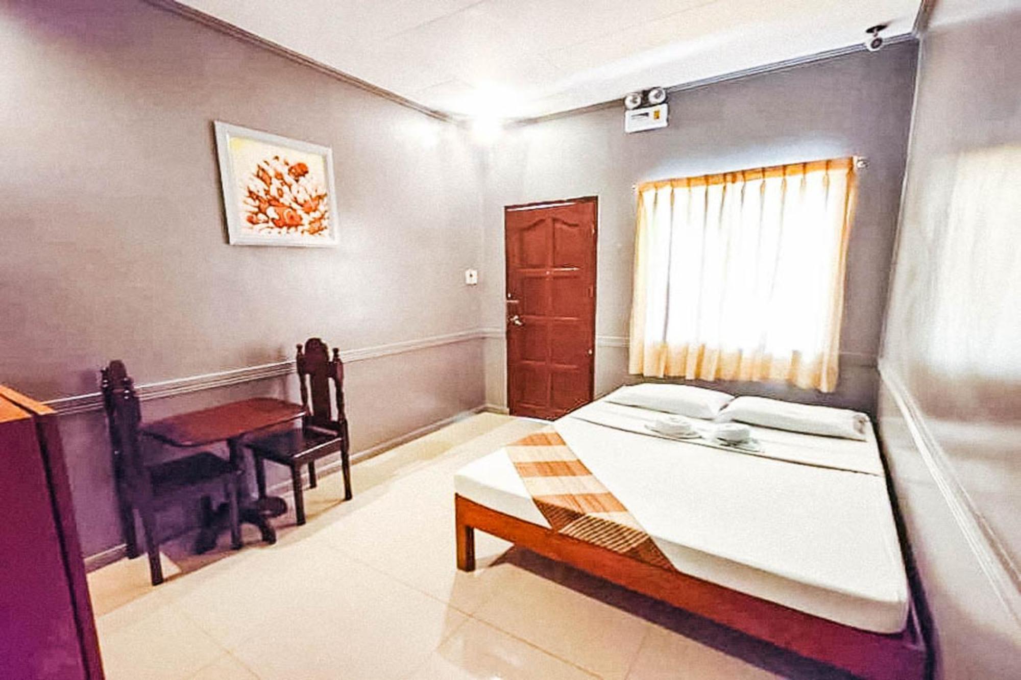 Mbg Travellers Inn Powered By Cocotel Puerto Princesa Rom bilde