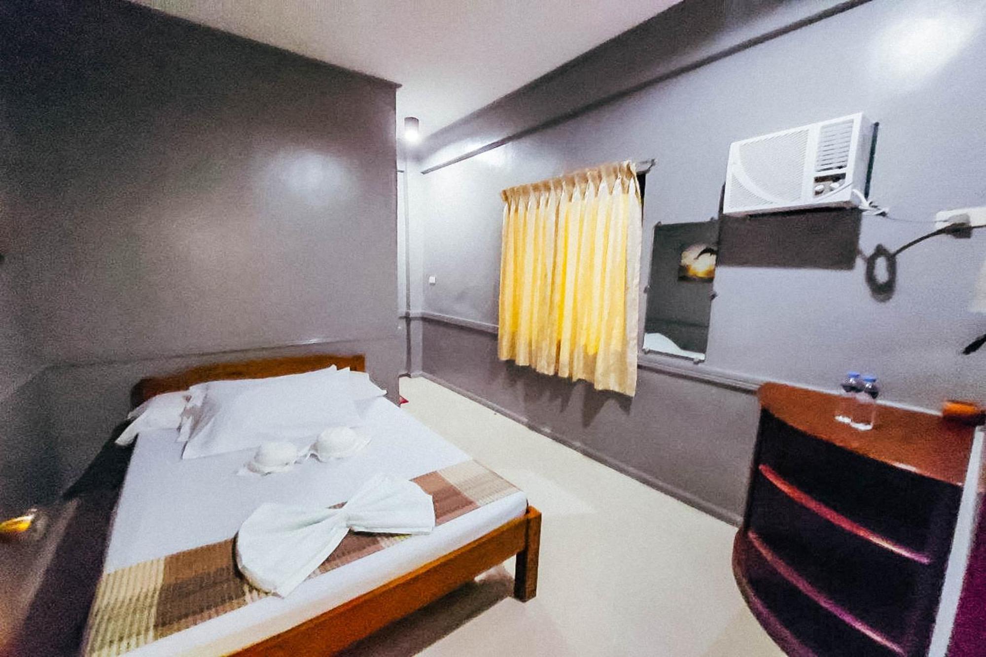 Mbg Travellers Inn Powered By Cocotel Puerto Princesa Rom bilde