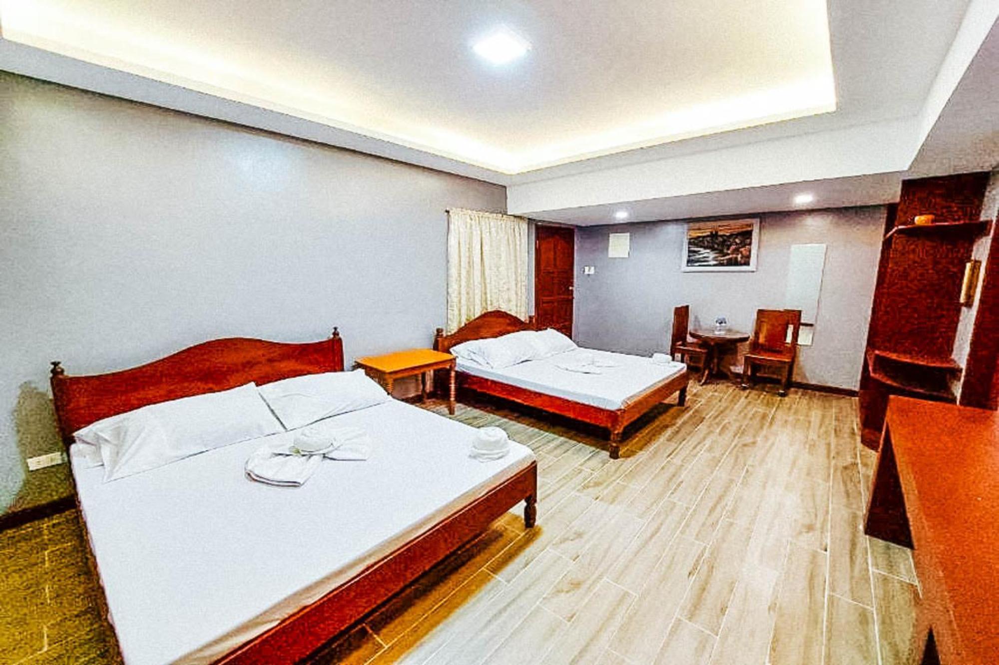 Mbg Travellers Inn Powered By Cocotel Puerto Princesa Rom bilde