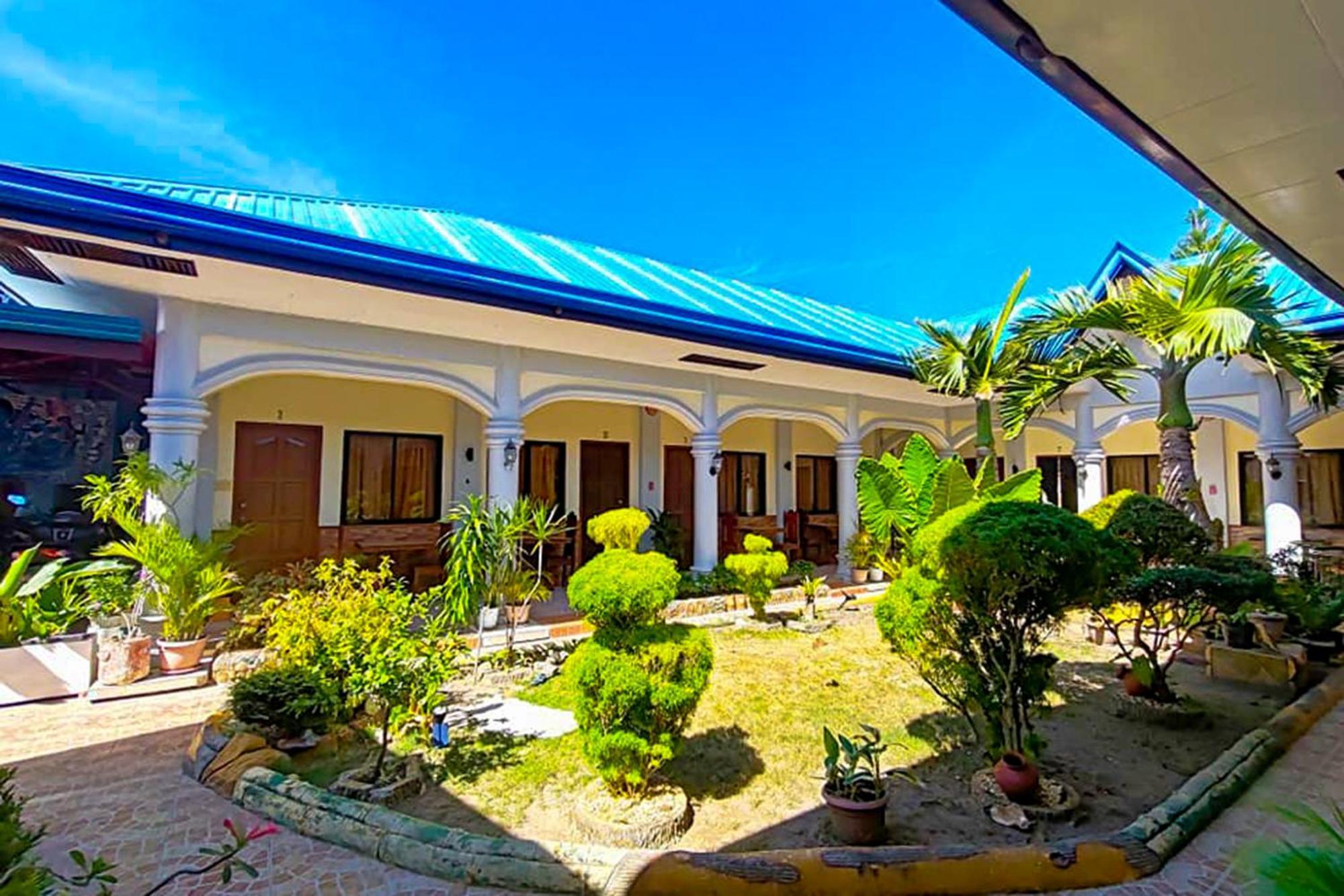 Mbg Travellers Inn Powered By Cocotel Puerto Princesa Eksteriør bilde